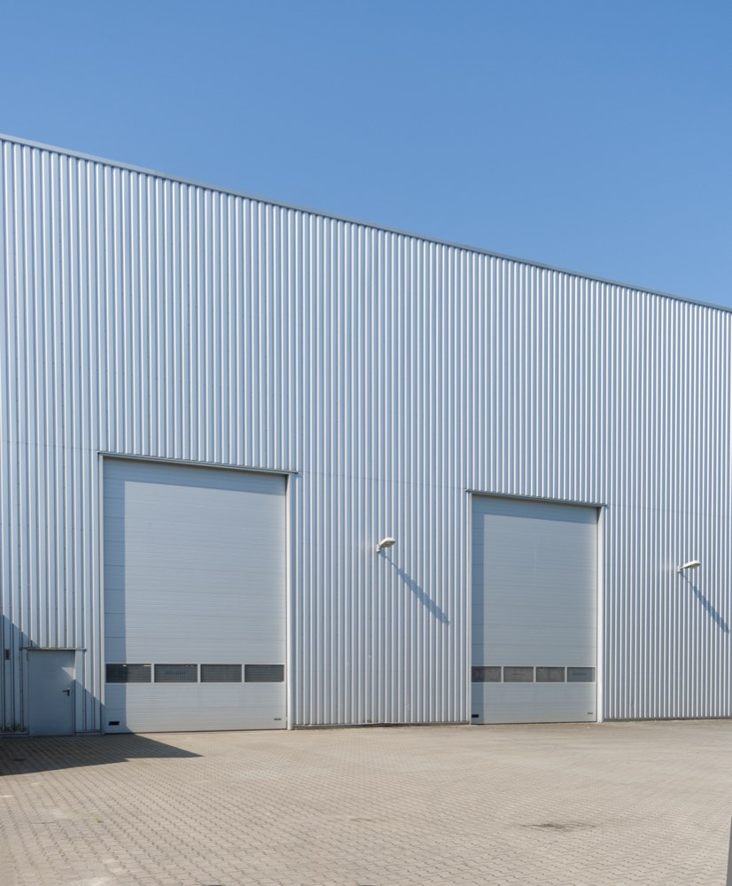 The metal facade of a modern industrial building.